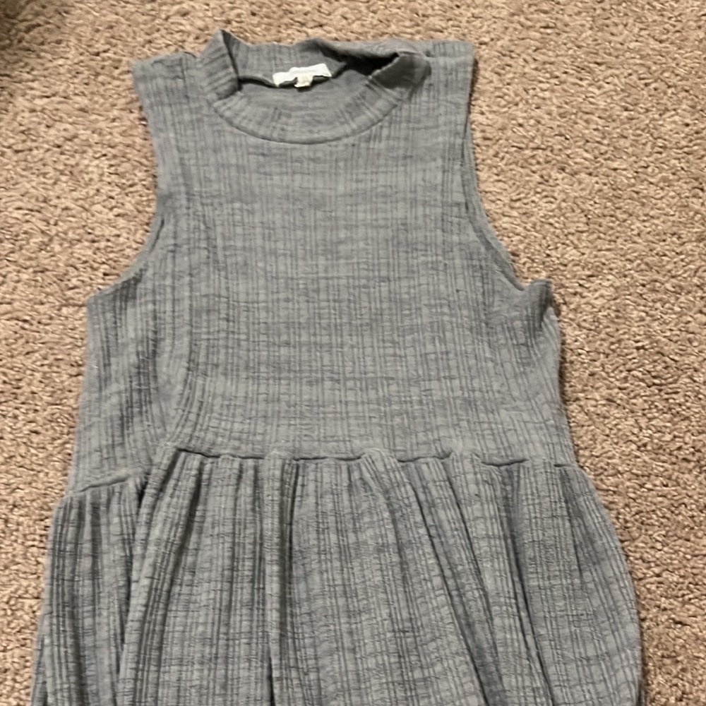 Maurice’s grey tank top